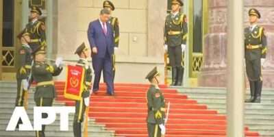 Xi Jinping Descends Stairs to Receive Putin in Beijing 8